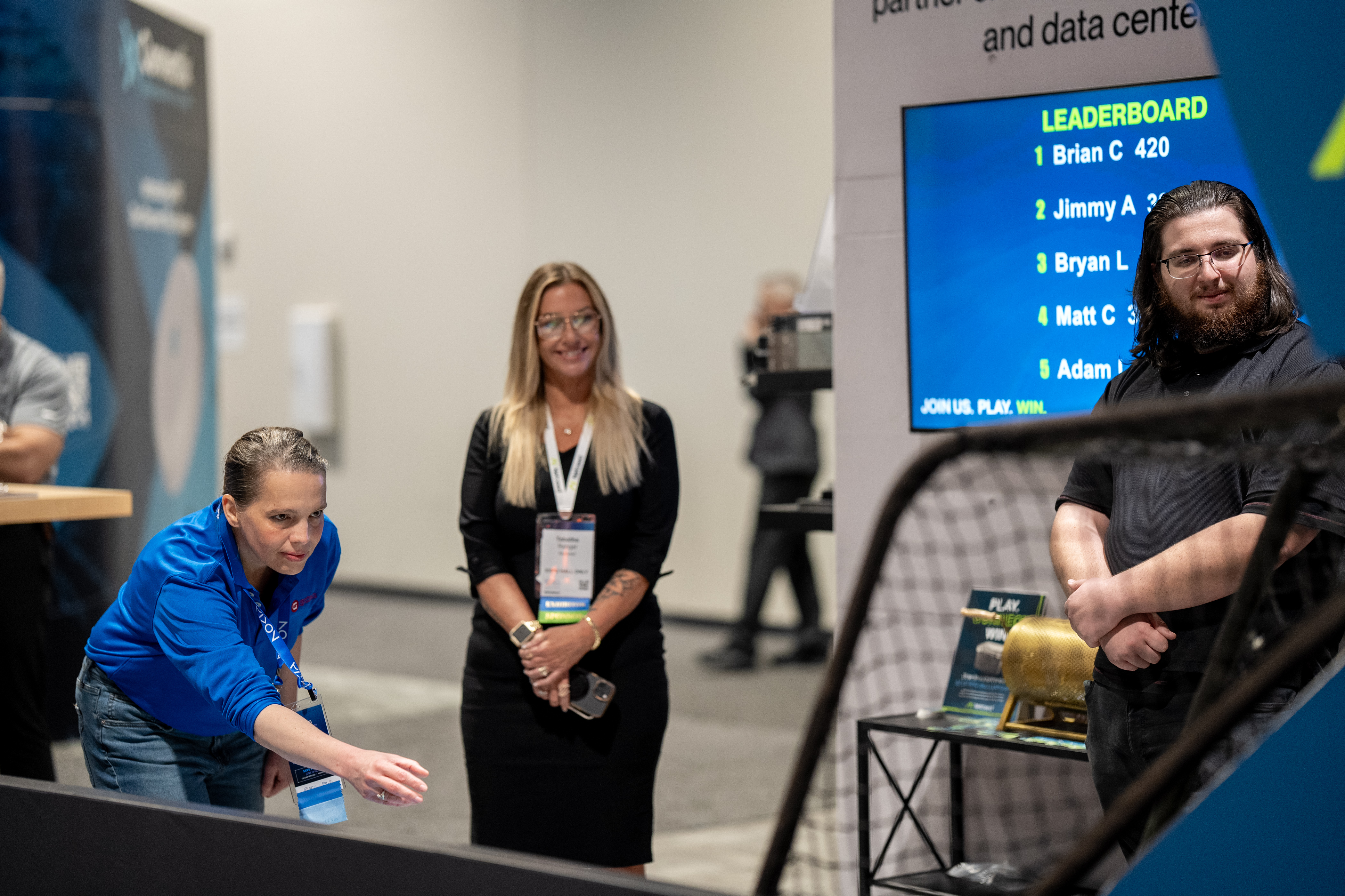 Hannah and colleagues at the Graphical Networks booth during Fiber Connect.