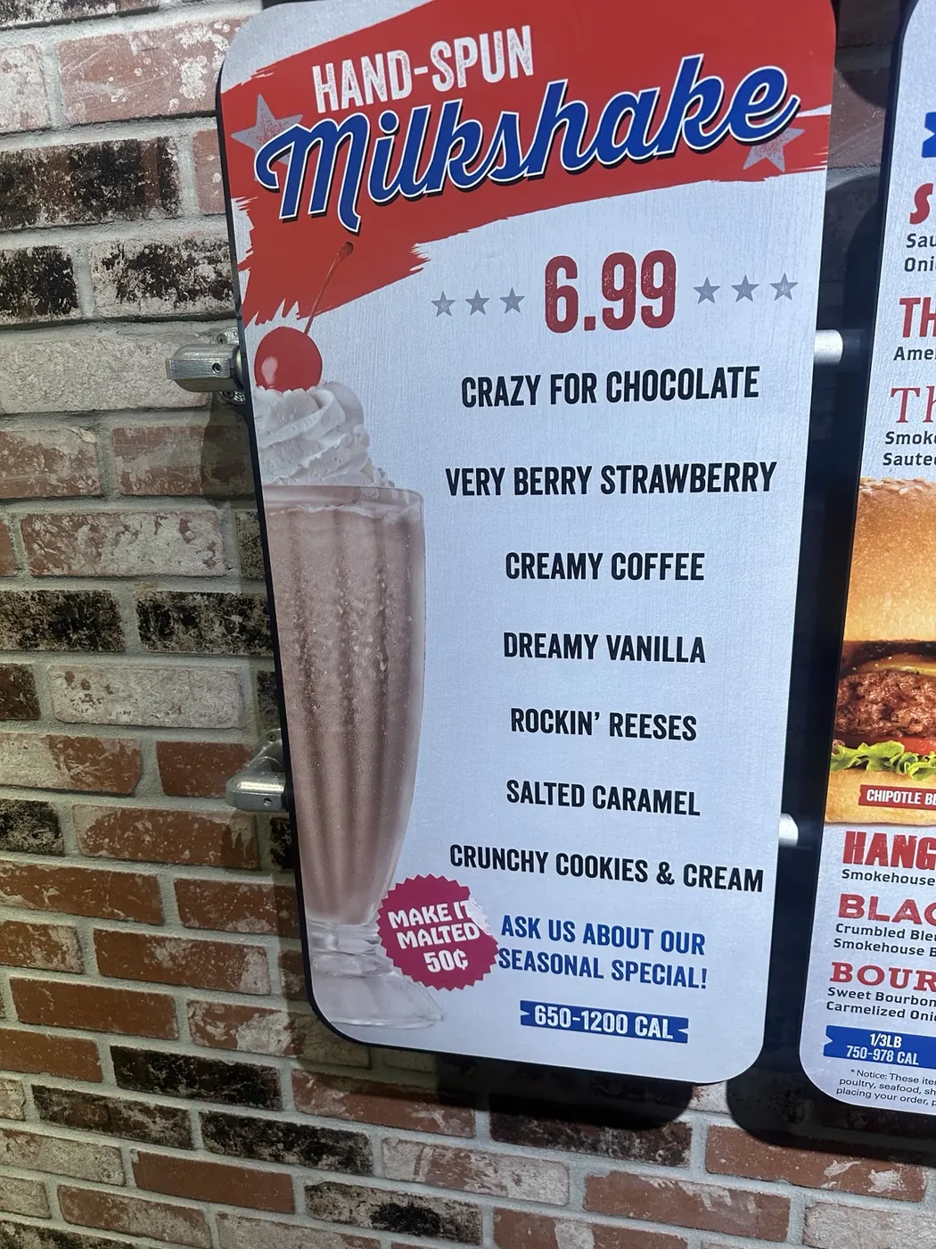 A Fuddruckers hand-spun milkshake menu with chocolate, strawberry, vanilla and other flavors.