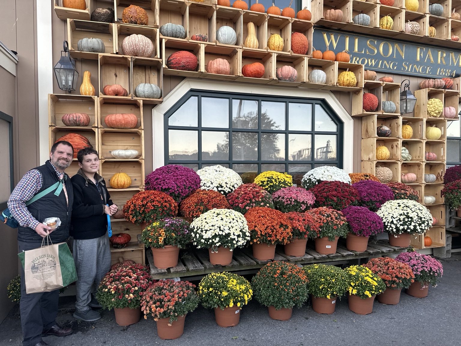 A family photograph from an autumn visit to Wilson Farm in Lexington, showing how a familiar local outing can become a saveable seasonal recommendation.